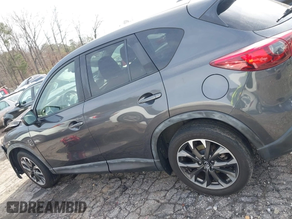 2016 Mazda CX-5 Grand Touring z VIN JM3KE4DY5G0836891, wystawiony jako IAAI lot #41441065 z przebiegiem 120 808 mil mil oraz . Historia ofert i sprzedaży dostępna na DreamBid. Obrazek 14.