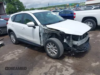 2013 Mazda CX-5 Sport with VIN JM3KE2BE0D0159483, listed as a IAAI auction lot 42488846 with 142,006 mi miles and . Bid and sale history available at DreamBid. Image 1.