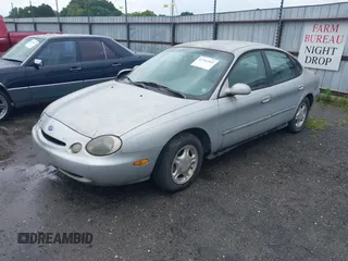 1997 Ford Taurus GL z VIN 1FALP52UXVG180596, wystawiony jako IAAI lot #42463461 z przebiegiem 190 419 mil mil oraz . Historia ofert i sprzedaży dostępna na DreamBid. Obrazek 2.