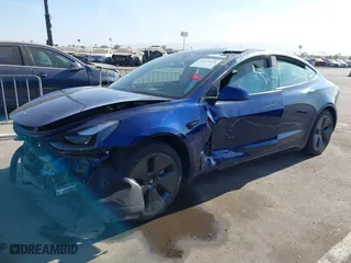 2023 Tesla Model 3 with VIN 5YJ3E1EA9PF697573, listed as a IAAI auction lot 41173833 with 6,966 mi miles. Bid and sale history available at carsss.com. Image 19.