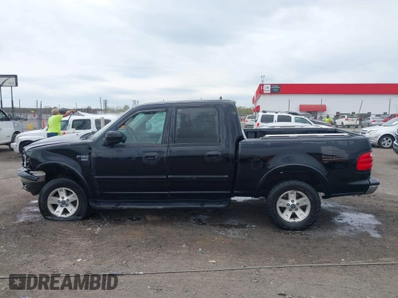 2002 Ford F-150 XLT with VIN 1FTRW08L32KD90202, listed as a IAAI auction lot 41850546 with 256,807 mi miles. Bid and sale history available at carsss.com. Image 14.