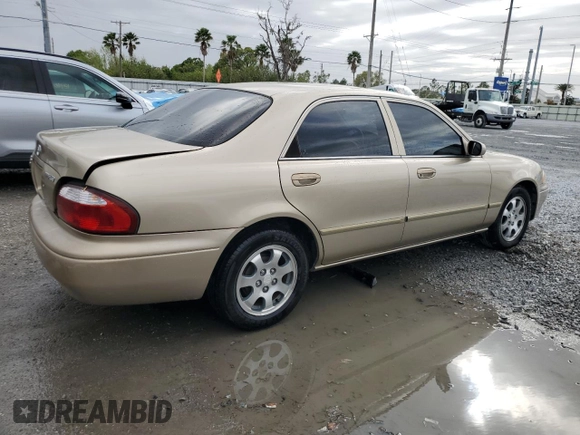 2001 Mazda 626 LX z VIN 1YVGF22CX15238033, wystawiony jako Copart lot #47245985 z przebiegiem 91 735 mil mil oraz Szkoda całkowita • Salvage title. Historia ofert i sprzedaży dostępna na DreamBid. Obrazek 3.