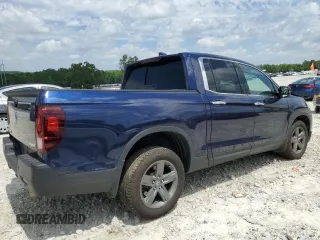 2023 Honda Ridgeline RTL-E with VIN 5FPYK3F74PB037333, listed as a Copart auction lot 56209715 with 36,041 mi miles and Salvage title. Bid and sale history available at DreamBid. Image 3.
