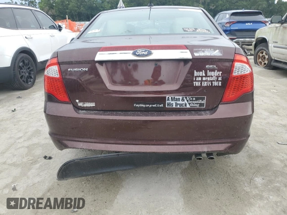2012 Ford Fusion SEL z VIN 3FAHP0JA5CR184593, wystawiony jako Copart lot #61647265 z przebiegiem 127 720 mil mil oraz Szkoda całkowita • Salvage title. Historia ofert i sprzedaży dostępna na DreamBid. Obrazek 6.