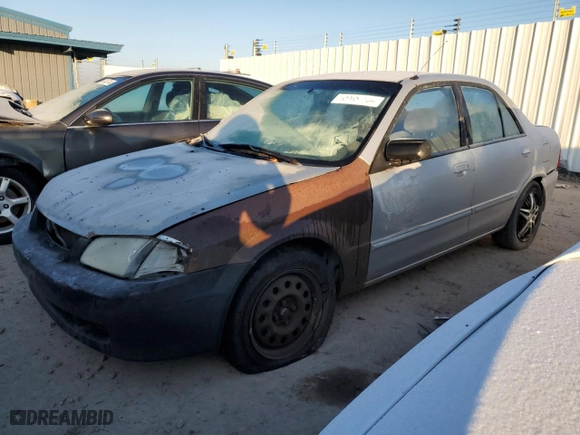 2000 Mazda Protege ES with VIN JM1BJ2213Y0266275, listed as a Copart auction lot 59480054 with 189,616 mi miles and Salvage Title. Bid and sale history available at carsss.com. Image 1.