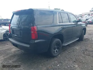2019 Chevrolet Tahoe Commercial with VIN 1GNLCDECXKR208052, listed as a IAAI auction lot 42014348 with 96,455 mi miles. Bid and sale history available at carsss.com. Image 4.