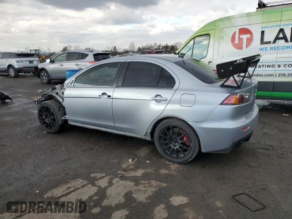 2014 Mitsubishi Lancer Evolution GSR z VIN JA32W8FVXEU000210, wystawiony jako Copart lot #87228694 z przebiegiem 120 356 mil mil oraz Szkody całkowita. Historia ofert i sprzedaży dostępna na DreamBid. Obrazek 2.