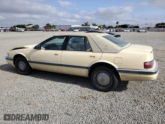 1992 Cadillac Seville z VIN 1G6KS53B0NU837105, wystawiony jako Copart lot #55865205 z przebiegiem 94 740 mil mil oraz Szkody całkowita. Historia ofert i sprzedaży dostępna na DreamBid. Obrazek 2.