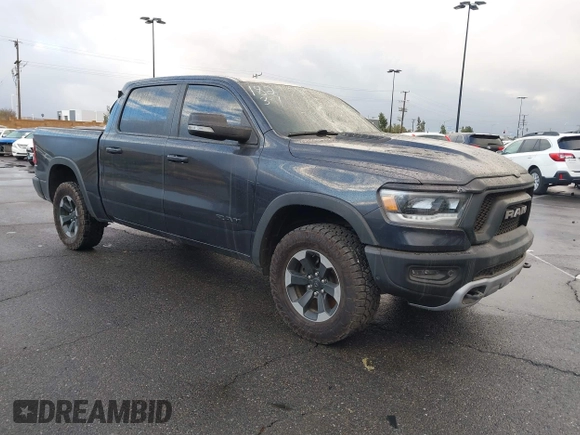 2019 Ram 1500 Rebel z VIN 1C6SRFLT2KN900600, wystawiony jako IAAI lot #41307832 z przebiegiem 74 481 mil mil oraz . Historia ofert i sprzedaży dostępna na DreamBid. Obrazek 1.