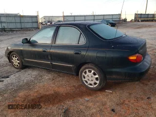 2000 Hyundai Elantra GLS z VIN KMHJF35F6YU890800, wystawiony jako Copart lot #76972294 z przebiegiem 159 134 mil mil oraz Szkoda całkowita • Salvage title. Historia ofert i sprzedaży dostępna na DreamBid. Obrazek 2.