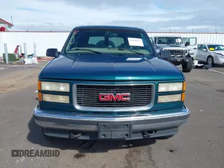 1999 GMC Yukon with VIN 1GKEK13R3XJ717999, listed as a IAAI auction lot 41870187 with 179,855 mi miles. Bid and sale history available at carsss.com. Image 12.