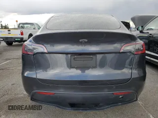 2024 Tesla Model Y with VIN 7SAYGDED1RF052031, listed as a Copart auction lot 48507865 with 5,365 mi miles and Salvage title. Bid and sale history available at DreamBid. Image 6.