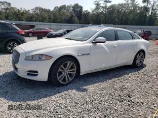 2013 Jaguar XJ Portfolio with VIN SAJWJ2GD5D8V49553, listed as a Copart auction lot 75116544 with 154,573 mi miles and Salvage Title. Bid and sale history available at DreamBid. Image 1.