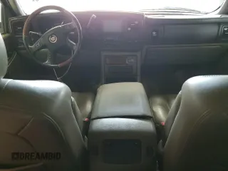 2006 Cadillac Escalade z VIN 1GYEK63N56R139033, wystawiony jako Copart lot #59661465 z przebiegiem Nie podano mil oraz Czysty tytuł • Clean title. Historia ofert i sprzedaży dostępna na DreamBid. Obrazek 8.