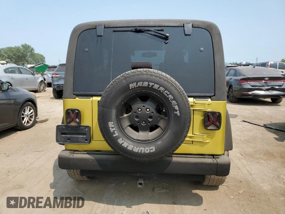 2003 Jeep Wrangler Sahara with VIN 1J4FA59S03P313418, listed as a Copart auction lot 64883094 with 184,658 mi miles and Salvage title. Bid and sale history available at DreamBid. Image 6.