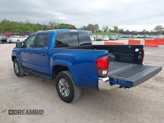 2018 Toyota Tacoma SR5 with VIN 3TMAZ5CNXJM069212, listed as a IAAI auction lot 42010564 with 73,825 mi miles and . Bid and sale history available at DreamBid. Image 3.