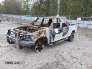 2002 Ford F-150 XLT with VIN 1FTRW08L32KE34232, listed as a IAAI auction lot 41930210 with 1 mi miles. Bid and sale history available at carsss.com. Image 2.