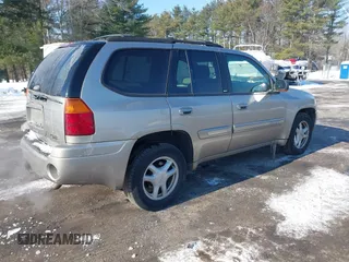 2002 GMC Envoy SLT with VIN 1GKDT13S822154592, listed as a IAAI auction lot 41389285 with 153,897 mi miles. Bid and sale history available at carsss.com. Image 4.