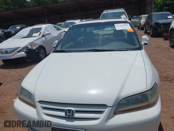 2002 Honda Accord EX z VIN 1HGCG16592A037760, wystawiony jako IAAI lot #42334100 z przebiegiem 271 805 mil mil oraz . Historia ofert i sprzedaży dostępna na DreamBid. Obrazek 6.