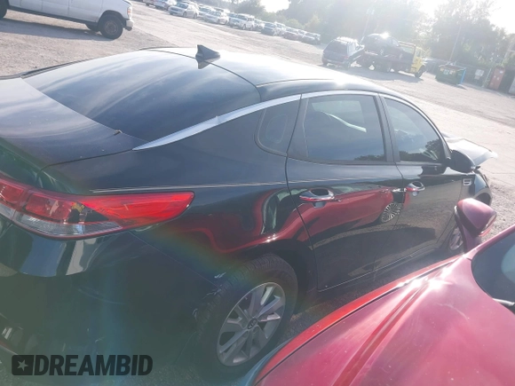2016 Kia Optima LX with VIN 5XXGT4L31GG022844, listed as a IAAI auction lot 41240100 with 121,586 mi miles and . Bid and sale history available at DreamBid. Image 13.