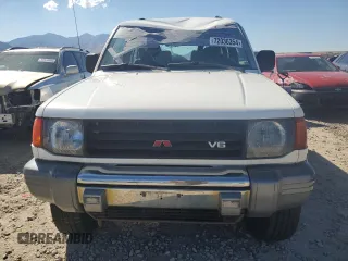 1995 Mitsubishi Montero z VIN JA4MR41H3SJ004800, wystawiony jako Copart lot #72036354 z przebiegiem 209 635 mil mil oraz Szkody całkowita. Historia ofert i sprzedaży dostępna na DreamBid. Obrazek 5.