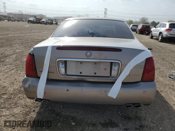 2001 Cadillac DeVille z VIN 1G6KD54YX1U242656, wystawiony jako Copart lot #54566105 z przebiegiem 200 016 mil mil oraz Szkoda całkowita • Salvage title. Historia ofert i sprzedaży dostępna na DreamBid. Obrazek 6.