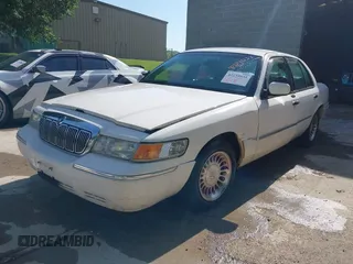 2002 Mercury Grand Marquis LS Premium with VIN 2MEFM75W82X642134, listed as a IAAI auction lot 42134033 with 252,295 mi miles and . Bid and sale history available at DreamBid. Image 2.