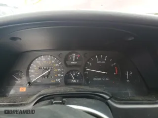 1996 Ford Thunderbird LX with VIN 1FALP62W7TH135632, listed as a Copart auction lot 77134024 with 128,931 mi miles and Salvage Title. Bid and sale history available at carsss.com. Image 9.