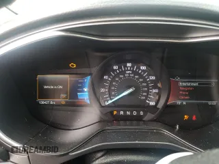 2019 Ford Fusion Titanium z VIN 3FA6P0D99KR221328, wystawiony jako Copart lot #57104515 z przebiegiem 138 427 mil mil oraz Szkoda całkowita • Salvage title. Historia ofert i sprzedaży dostępna na DreamBid. Obrazek 9.
