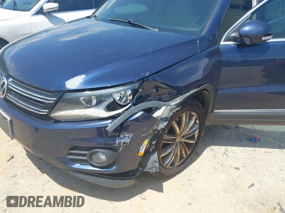 2012 Volkswagen Tiguan SE with VIN WVGAV7AX7CW534703, listed as a IAAI auction lot 42463358 with 119,699 mi miles and . Bid and sale history available at DreamBid. Image 6.