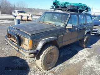 1996 Jeep Cherokee Country with VIN 1J4FJ78S8TL194375, listed as a IAAI auction lot 41286995 with 147,792 mi miles. Bid and sale history available at carsss.com. Image 2.