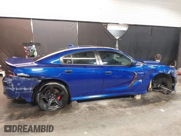 2022 Dodge Charger R/T with VIN 2C3CDXCT9NH127952, listed as a IAAI auction lot 42020401 with 55,483 mi miles and . Bid and sale history available at carsss.com. Image 6.