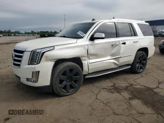 2015 Cadillac Escalade Premium with VIN 1GYS4CKJ4FR275907, listed as a Copart auction lot 61444955 with 150,055 mi miles and Salvage title. Bid and sale history available at DreamBid. Image 1.