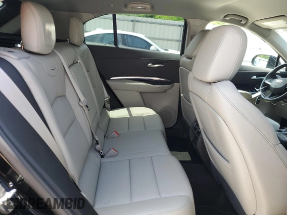 2023 Cadillac XT4 FWD Luxury с VIN 1GYAZAR47PF107473, выставлен на аукционе Copart как лот 59137665 с пробегом 9 198 миль миль и Списание • Salvage title. История ставок и продаж доступна на DreamBid. Изображение 11.