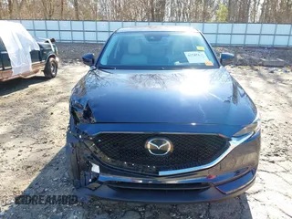 2021 Mazda CX-5 Grand Touring with VIN JM3KFADM5M0428279, listed as a IAAI auction lot 41747175 with 49,579 mi miles. Bid and sale history available at carsss.com. Image 13.