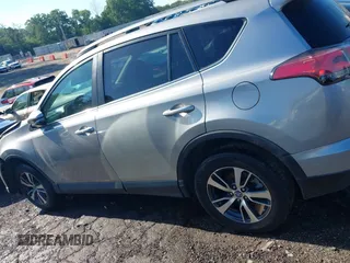2018 Toyota RAV4 XLE with VIN 2T3WFREV6JW442859, listed as a IAAI auction lot 42252071 with 67,749 mi miles and . Bid and sale history available at DreamBid. Image 14.