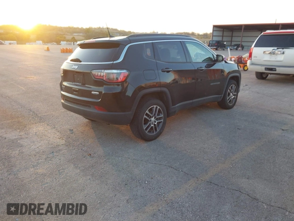 2017 Jeep Compass Latitude with VIN 3C4NJDBB8HT664781, listed as a IAAI auction lot 40670412 with 125,593 mi miles. Bid and sale history available at carsss.com. Image 4.