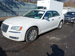 2013 Chrysler 300 with VIN 2C3CCAKGXDH733148, listed as a IAAI auction lot 41541442 with 216,074 mi miles. Bid and sale history available at carsss.com. Image 2.