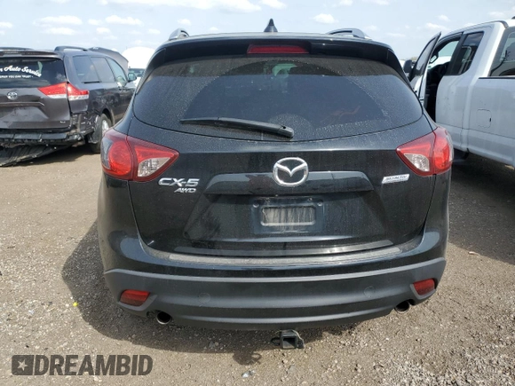 2015 Mazda CX-5 Grand Touring with VIN JM3KE4DY9F0516357, listed as a Copart auction lot 53156215 with 118,621 mi miles and Salvage Title. Bid and sale history available at DreamBid. Image 6.