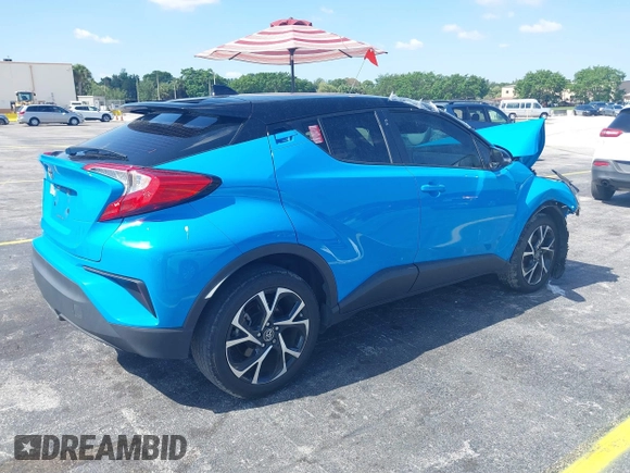 2019 Toyota C-HR XLE with VIN NMTKHMBX6KR097934, listed as a IAAI auction lot 39276687 with 56,973 mi miles. Bid and sale history available at carsss.com. Image 4.