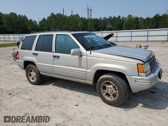1998 Jeep Grand Cherokee Limited with VIN 1J4GZ78Y5WC324828, listed as a Copart auction lot 58992125 with 225,705 mi miles and Salvage title. Bid and sale history available at DreamBid. Image 4.