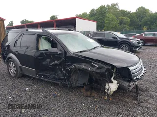 2008 Ford Taurus X SEL z VIN 1FMDK05W28GA04056, wystawiony jako IAAI lot #39968459 z przebiegiem 214 139 mil mil oraz . Historia ofert i sprzedaży dostępna na DreamBid. Obrazek 1.