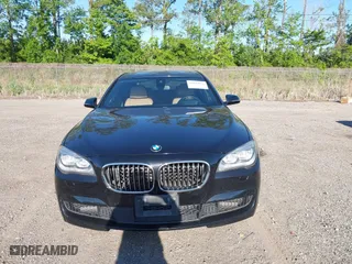 2015 BMW 7 Series 750Li with VIN WBAYE8C50FD781384, listed as a IAAI auction lot 42049829 with 128,087 mi miles. Bid and sale history available at carsss.com. Image 12.