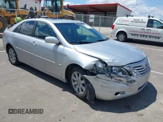 2007 Toyota Camry LE z VIN JTNBK46K273014828, wystawiony jako IAAI lot #42221939 z przebiegiem 242 607 mil mil oraz . Historia ofert i sprzedaży dostępna na DreamBid. Obrazek 1.