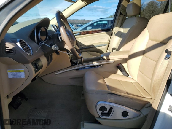 2010 Mercedes-Benz M 550 with VIN 4JGBB7CB8AA602077, listed as a Copart auction lot 83598804 with 111,633 mi miles and Salvage Title. Bid and sale history available at DreamBid. Image 7.