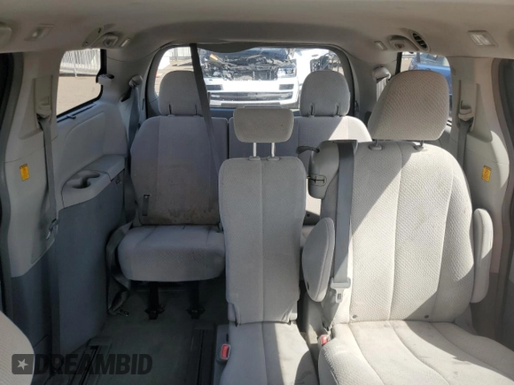 2012 Toyota Sienna LE AAS with VIN 5TDKK3DC7CS195590, listed as a Copart auction lot 57968415 with 201,732 mi miles and Salvage title. Bid and sale history available at DreamBid. Image 10.