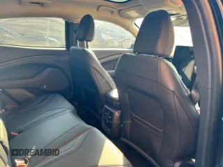 2021 Ford Mustang Mach-E Premium z VIN 3FMTK3SU0MMA43521, wystawiony jako Copart lot #69157472 z przebiegiem 1 659 mil mil oraz . Historia ofert i sprzedaży dostępna na DreamBid. Obrazek 5.