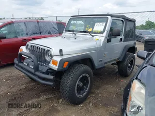 2004 Jeep Wrangler Sport with VIN 1J4FA49S44P772575, listed as a IAAI auction lot 42512876 with 226,387 mi miles and . Bid and sale history available at DreamBid. Image 2.