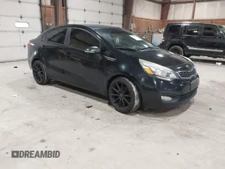 2013 Kia Rio SX with VIN KNADN4A38D6229948, listed as a IAAI auction lot 42007877 with 126,695 mi miles. Bid and sale history available at carsss.com. Image 1.