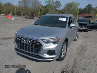 2020 Audi Q3 Premium with VIN WA1AECF36L1057823, listed as a IAAI auction lot 41912118 with 71,004 mi miles and . Bid and sale history available at DreamBid. Image 2.